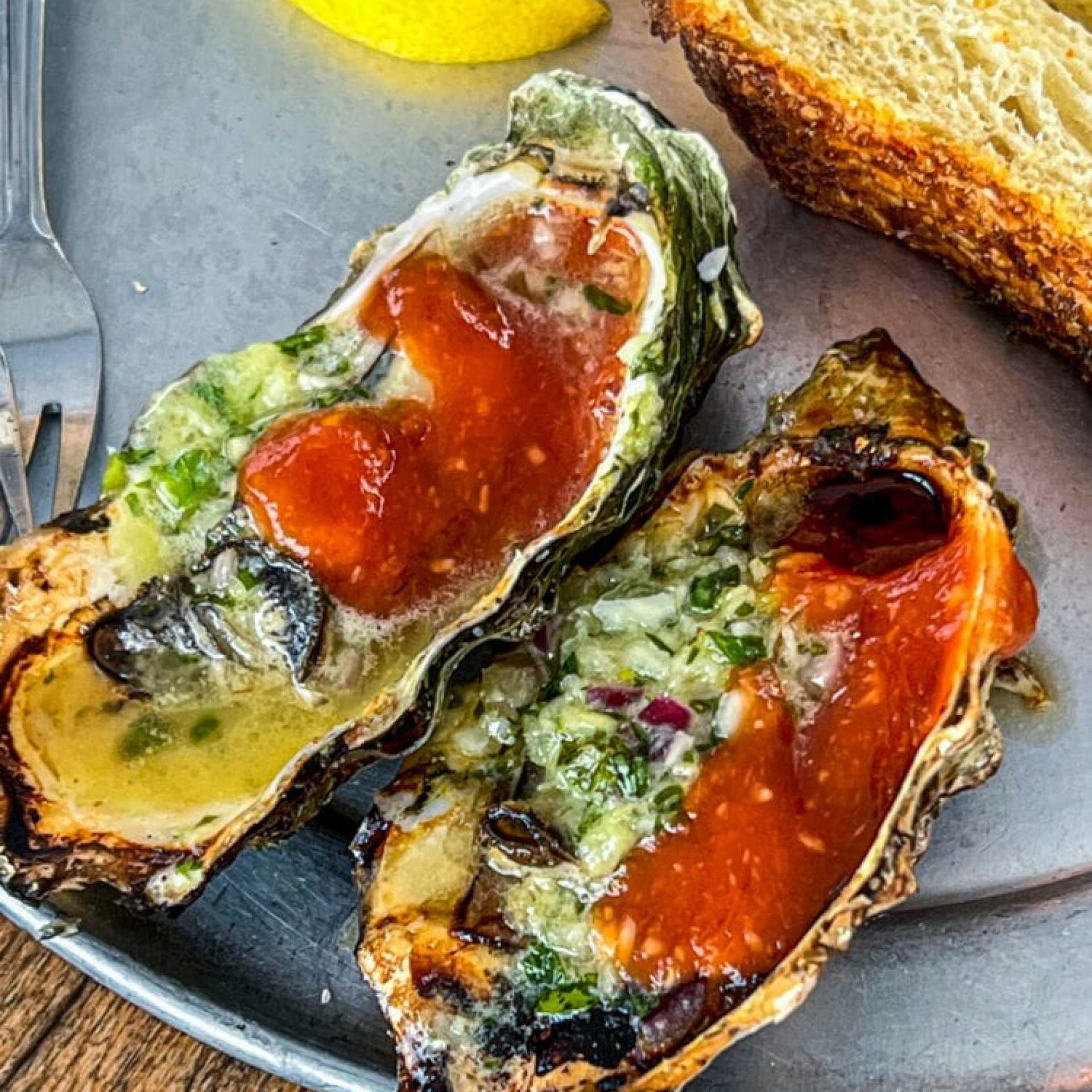 picture of bbq oysters on a metal plate